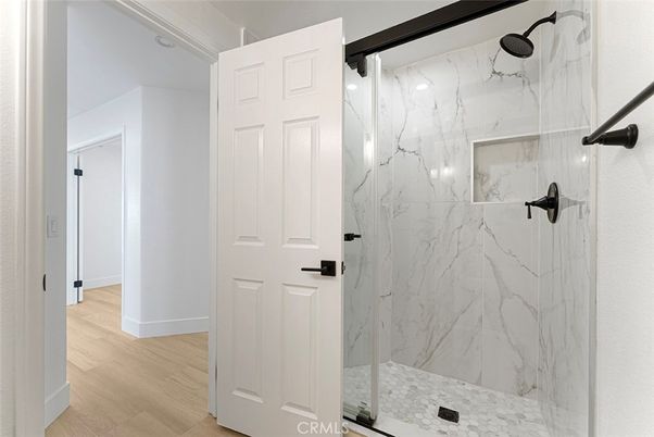 Bathroom, Glass Shower, Interior, Marble Walls, Wood Texture Flooring