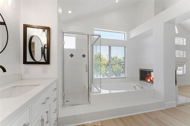 Bathroom, Fireplace, Glass Shower, Interior, Recessed Lighting, Wood Texture Flooring