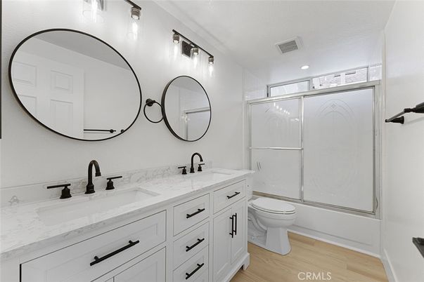 Bathroom, Dual Sink Vanities, Glass Shower, Interior, Recessed Lighting, Wood Texture Flooring