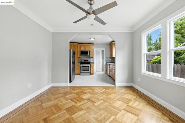 Empty room, Interior, Kitchen, Recessed Lighting, Stainless Steel Appliances, Wood Texture Flooring