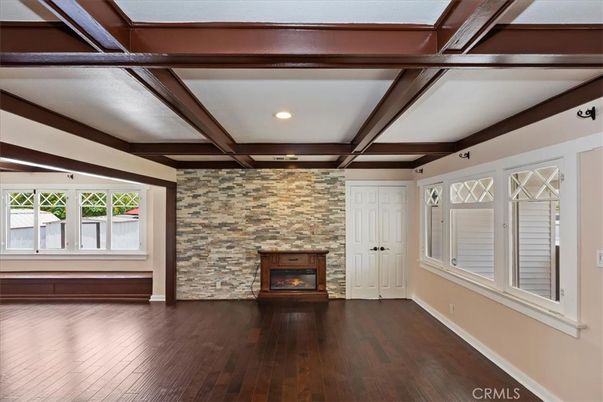 Empty room, Fireplace, Interior, Recessed Lighting, Stone Walls, Wooden Beams, Wood Texture Flooring