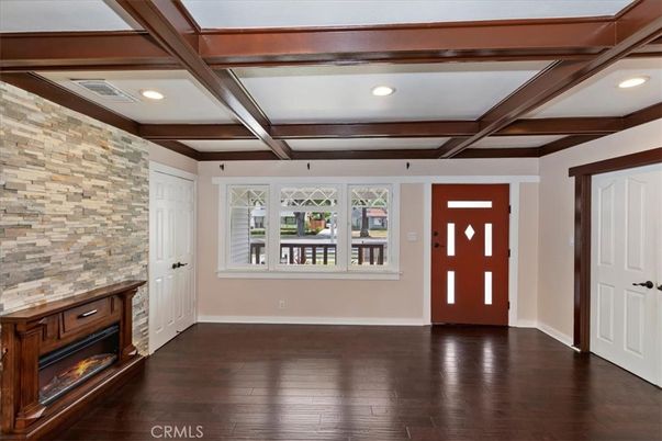 Empty room, Fireplace, Interior, Recessed Lighting, Stone Walls, Wooden Beams, Wood Texture Flooring