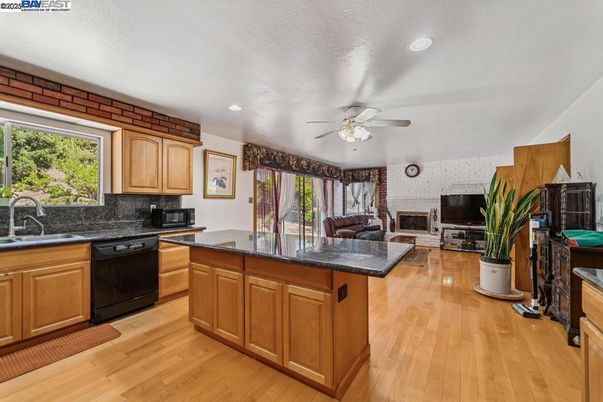 Fireplace, Interior, Kitchen, Recessed Lighting, Stone Walls, Wood Texture Flooring