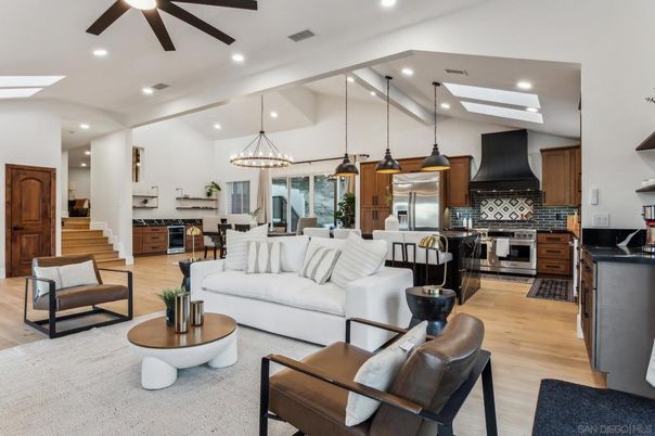 Chandelier, Dining room, Interior, Kitchen, Living room, Pendant Lights, Recessed Lighting, Stainless Steel Appliances, Wood Texture Flooring