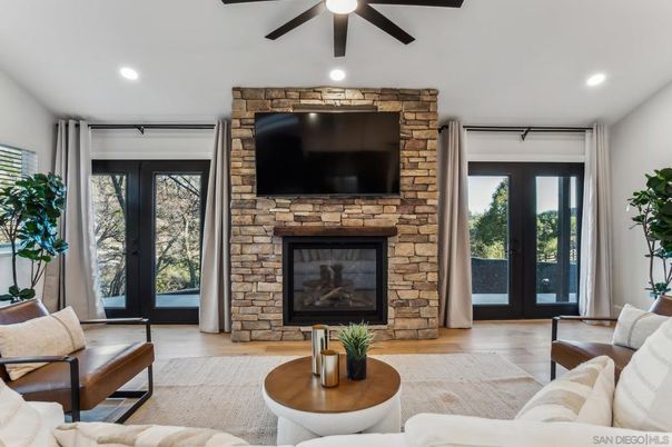 Fireplace, Interior, Living room, Recessed Lighting, Stone Walls, Wood Texture Flooring