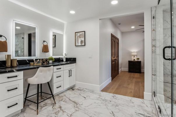 Bathroom, Dual Sink Vanities, Glass Shower, Interior, Marble, Recessed Lighting, Wood Texture Flooring