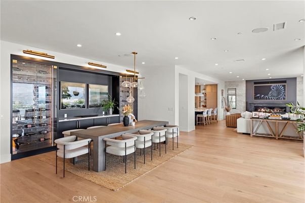 Dining room, Fireplace, Interior, Living room, Pendant Lights, Recessed Lighting, Wood Texture Flooring