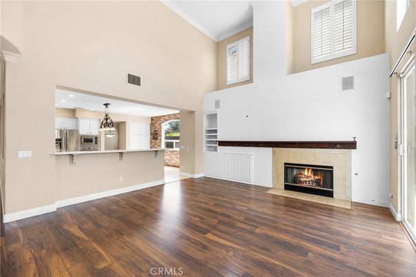 Empty room, Fireplace, Interior, Kitchen, Pendant Lights, Recessed Lighting, Wood Texture Flooring