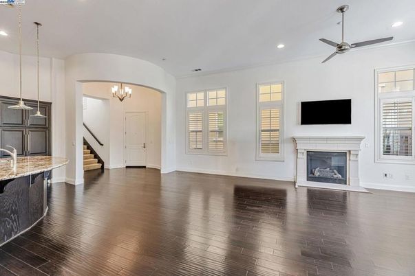 Chandelier, Empty room, Fireplace, Interior, Pendant Lights, Recessed Lighting, Wood Texture Flooring