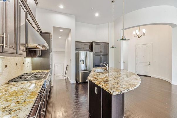 Chandelier, Interior, Kitchen, Pendant Lights, Recessed Lighting, Stainless Steel Appliances, Wood Texture Flooring