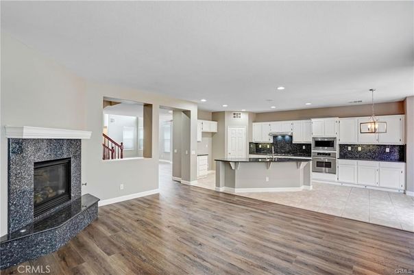 Fireplace, Interior, Kitchen, Pendant Lights, Recessed Lighting, Stainless Steel Appliances, Wood Texture Flooring