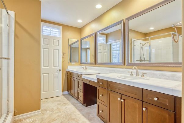 Bathroom, Dual Sink Vanities, Glass Shower, Interior, Recessed Lighting, Tile Countertops