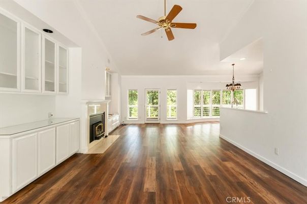 Chandelier, Empty room, Fireplace, Interior, Recessed Lighting, Wood Texture Flooring