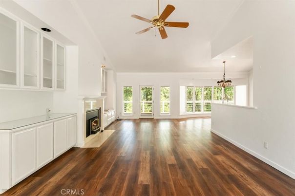 Chandelier, Empty room, Fireplace, Interior, Recessed Lighting, Wood Texture Flooring