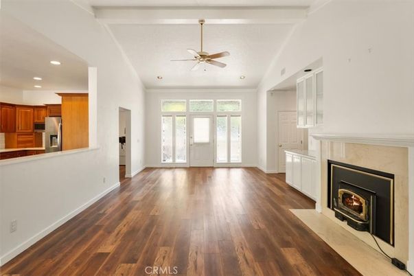 Empty room, Fireplace, Interior, Kitchen, Recessed Lighting, Wood Texture Flooring