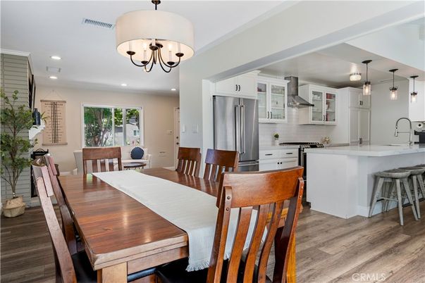Chandelier, Dining room, Interior, Kitchen, Pendant Lights, Recessed Lighting, Stainless Steel Appliances, Wood Texture Flooring