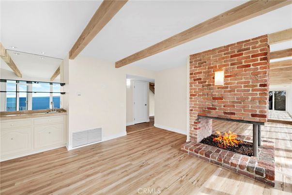 Empty room, Fireplace, Interior, Recessed Lighting, Stone Walls, Water, Wooden Beams, Wood Texture Flooring