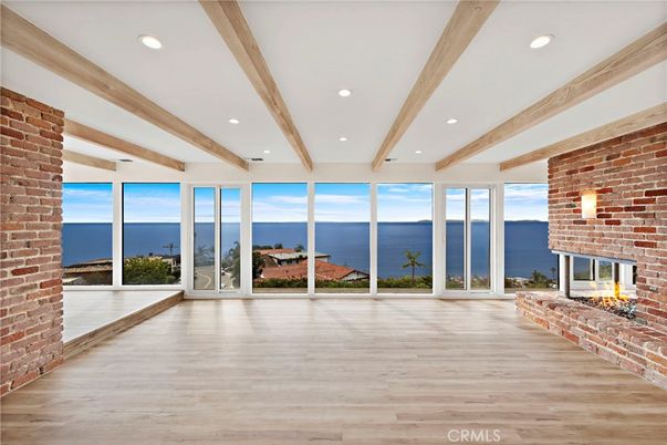 Empty room, Fireplace, Interior, Recessed Lighting, Stone Walls, Water, Wooden Beams, Wood Texture Flooring