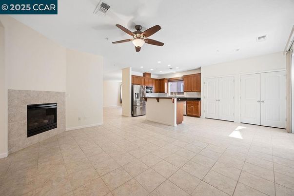 Empty room, Fireplace, Interior, Kitchen, Recessed Lighting, Stainless Steel Appliances