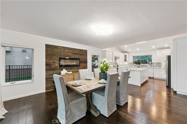 Dining room, Fireplace, Interior, Kitchen, Recessed Lighting, Stone Walls, Wood Texture Flooring