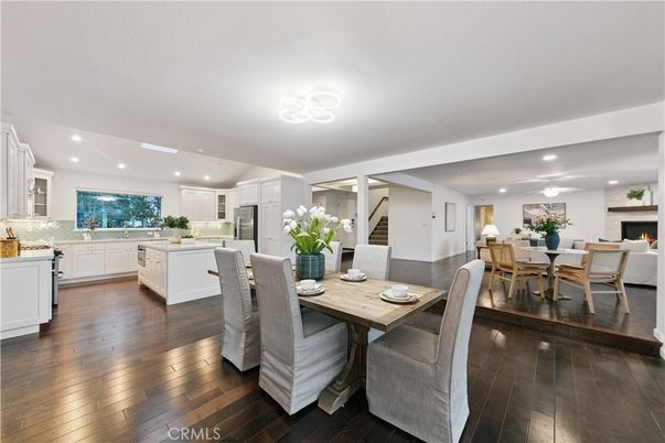 Dining room, Fireplace, Interior, Kitchen, Recessed Lighting, Stainless Steel Appliances, Wood Texture Flooring