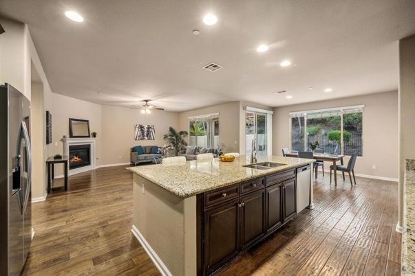 Dining room, Fireplace, Interior, Kitchen, Recessed Lighting, Wood Texture Flooring