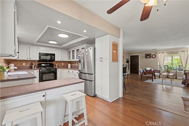 Dining room, Interior, Kitchen, Recessed Lighting, Stainless Steel Appliances, Wood Texture Flooring
