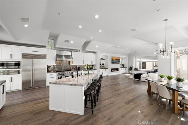 Dining room, Fireplace, Interior, Kitchen, Living room, Pendant Lights, Recessed Lighting, Stainless Steel Appliances, Wood Texture Flooring