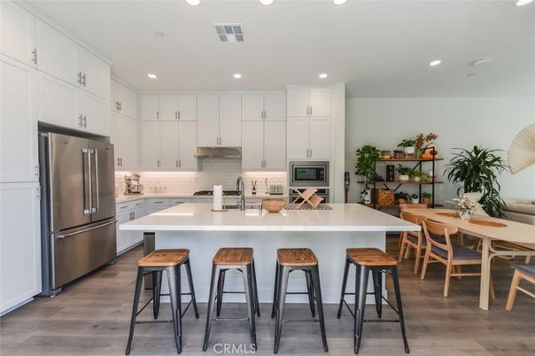 Dining room, Interior, Kitchen, Recessed Lighting, Stainless Steel Appliances, Wood Texture Flooring