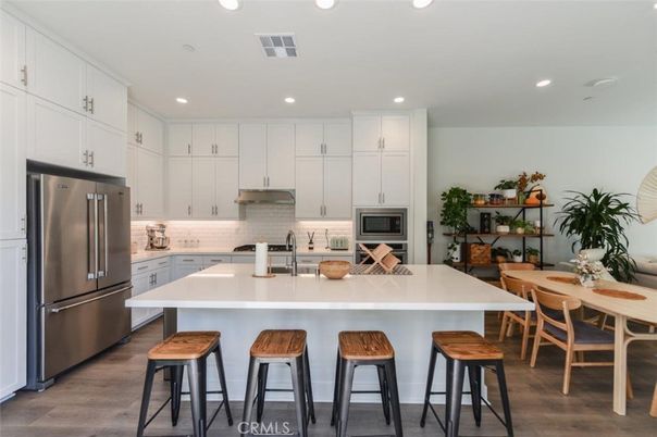 Dining room, Interior, Kitchen, Recessed Lighting, Stainless Steel Appliances, Wood Texture Flooring