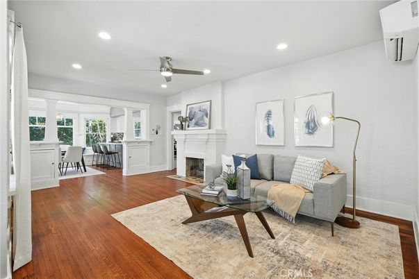Dining room, Fireplace, Interior, Living room, Recessed Lighting, Wood Texture Flooring