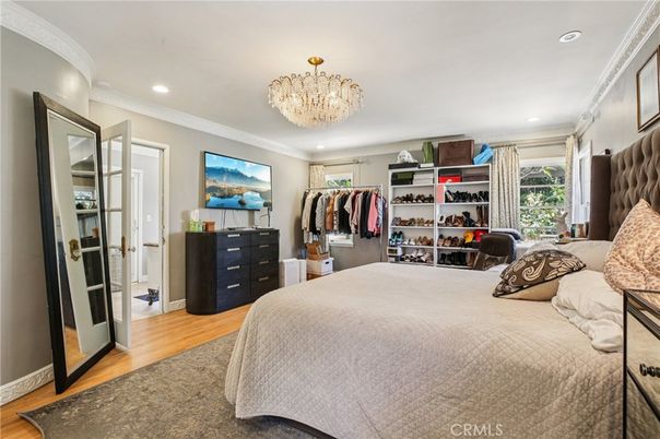 Bedroom, Chandelier, Interior, Recessed Lighting, Walk-in Closets, Wood Texture Flooring