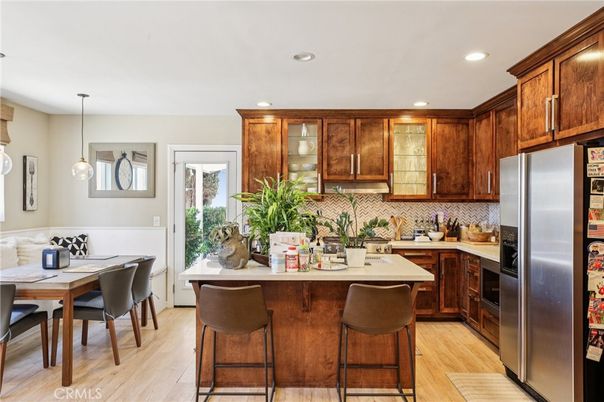 Dining room, Interior, Kitchen, Pendant Lights, Recessed Lighting, Stainless Steel Appliances, Wood Texture Flooring