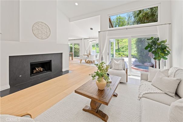 Dining room, Fireplace, Interior, Living room, Pendant Lights, Recessed Lighting, Wood Texture Flooring