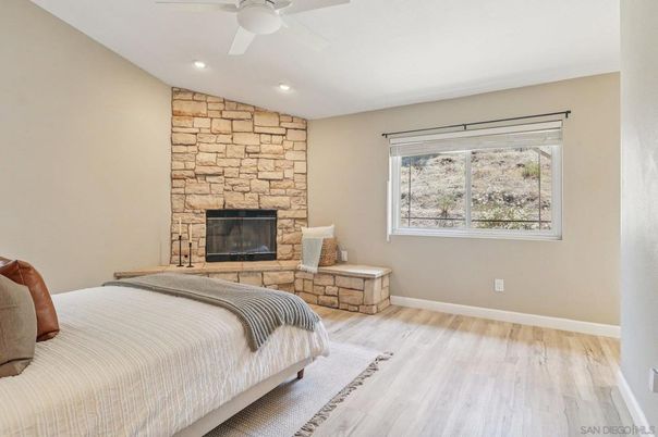 Bedroom, Fireplace, Interior, Recessed Lighting, Stone Walls, Wood Texture Flooring