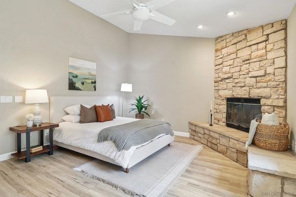 Bedroom, Fireplace, Interior, Recessed Lighting, Stone Walls, Wood Texture Flooring