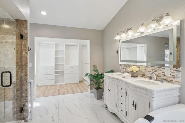 Bathroom, Dual Sink Vanities, Glass Shower, Interior, Marble, Recessed Lighting, Wood Texture Flooring