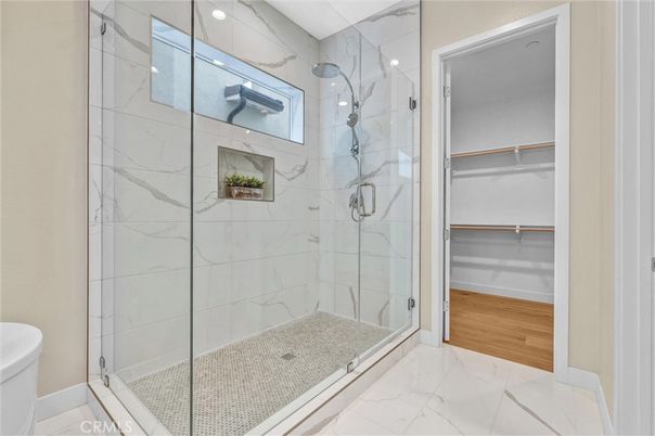Bathroom, Glass Shower, Interior, Marble, Marble Walls, Recessed Lighting, Wood Texture Flooring