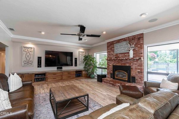 Fireplace, Interior, Living room, Recessed Lighting, Stone Walls, Wood Texture Flooring