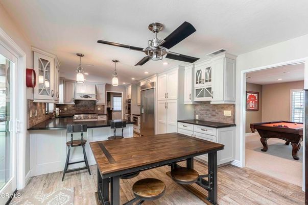 Billiard Table, Dining room, Interior, Kitchen, Pendant Lights, Recessed Lighting, Stainless Steel Appliances, Wood Texture Flooring
