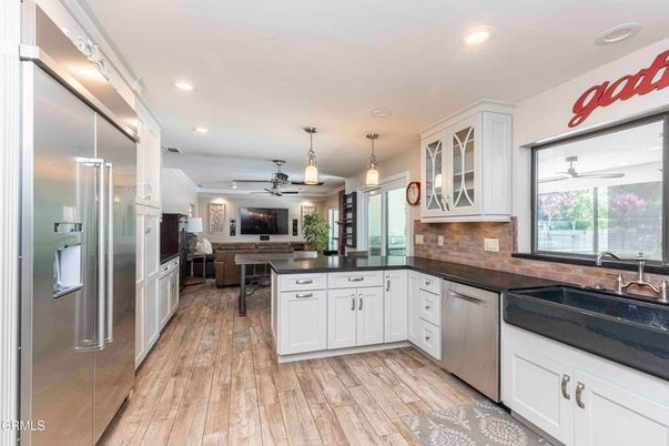 Dining room, Interior, Kitchen, Pendant Lights, Recessed Lighting, Stainless Steel Appliances, Wood Texture Flooring