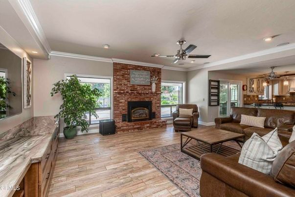 Fireplace, Interior, Living room, Pendant Lights, Recessed Lighting, Stone Walls, Wood Texture Flooring