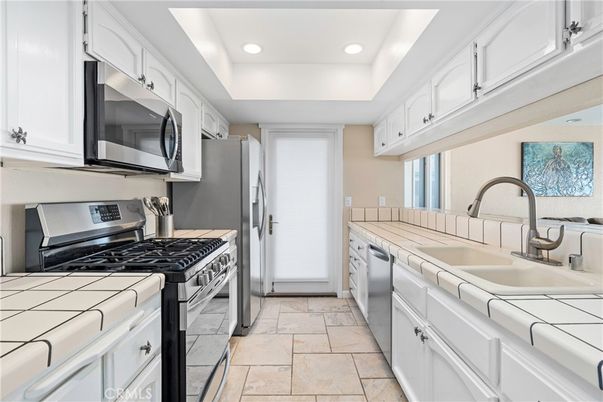 Interior, Kitchen, Recessed Lighting, Stainless Steel Appliances, Tile Countertops