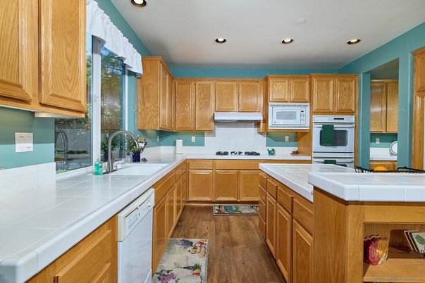 Interior, Kitchen, Recessed Lighting, Tile Countertops, Wood Texture Flooring