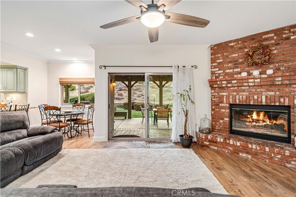 Dining room, Fireplace, Interior, Recessed Lighting, Stone Walls, Wood Texture Flooring