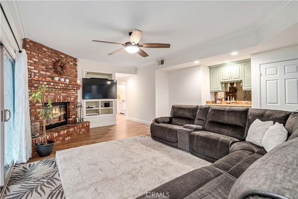 Fireplace, Interior, Living room, Recessed Lighting, Stone Walls, Wood Texture Flooring