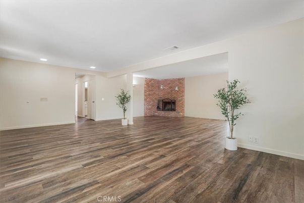 Empty room, Fireplace, Interior, Recessed Lighting, Stone Walls, Wood Texture Flooring