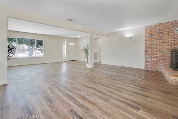 Empty room, Fireplace, Interior, Recessed Lighting, Stone Walls, Wood Texture Flooring