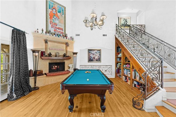 Billiard Table, Chandelier, Fireplace, Game Room, Interior, Wood Texture Flooring