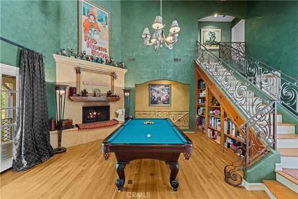 Billiard Table, Chandelier, Fireplace, Game Room, Interior, Wood Texture Flooring